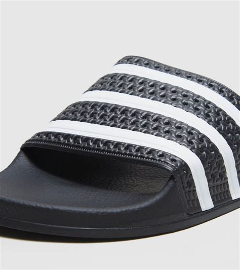 black Adidas slides men's